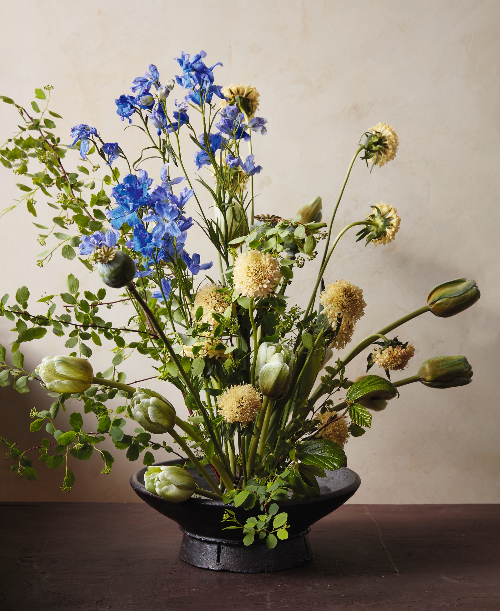 Taylor was inspired by the vivid sky small foliage and flinty rocks of the Bellini to cluster green tulips and blue...